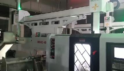 Application Technology of Loading and Unloading of Machine Tool Two Dragged Two Truss Manipulator